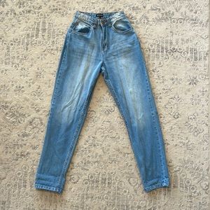 PrettyLittleThing mid-wash mom jeans.